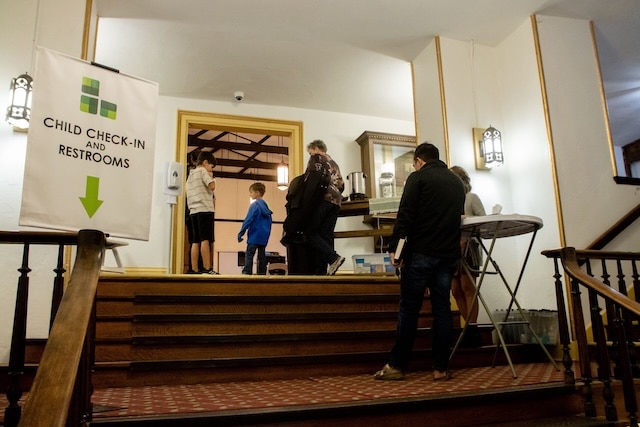 Folks walking into downtown church